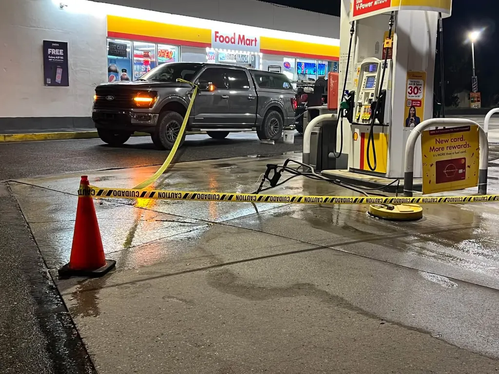 Pressure washing concrete at a fuel station